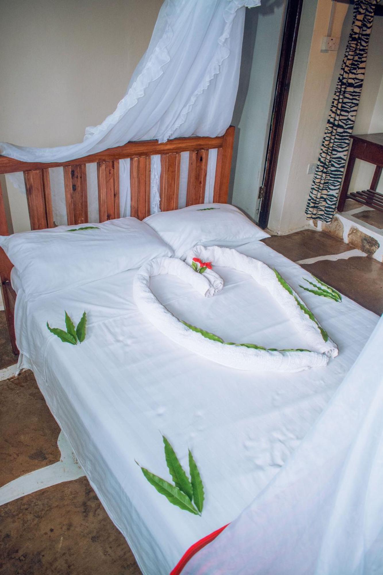 דיאני ביץ' Kijani Cottages In Diani מראה חיצוני תמונה